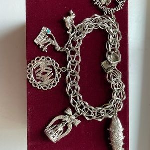 VintageSterling silver double  loop charm bracelet w 6 charms.